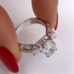 Handmade 3 CT Oval Cut Engagement Ring with Two Princess Sidestones