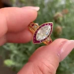 Handmade 1 CT Marquise Cut Enagement Ring with a Ruby Calibre Halo