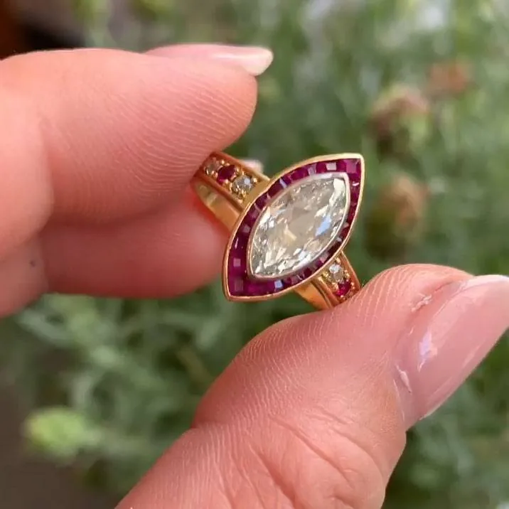 Handmade 1 CT Marquise Cut Enagement Ring with a Ruby Calibre Halo