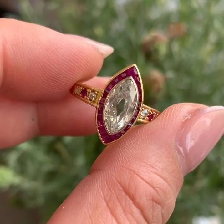 Handmade 1 CT Marquise Cut Enagement Ring with a Ruby Calibre Halo
