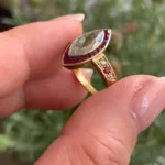 Handmade 1 CT Marquise Cut Enagement Ring with a Ruby Calibre Halo